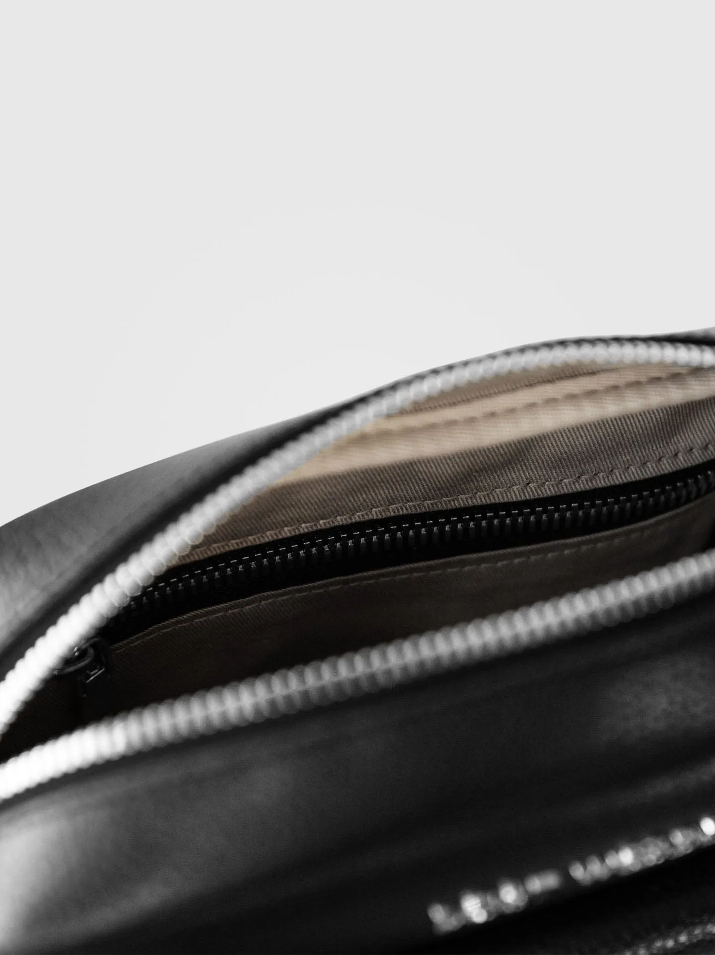 Aster MIRUM® Leather Vegan Crossbody Bag | Black & Silver
