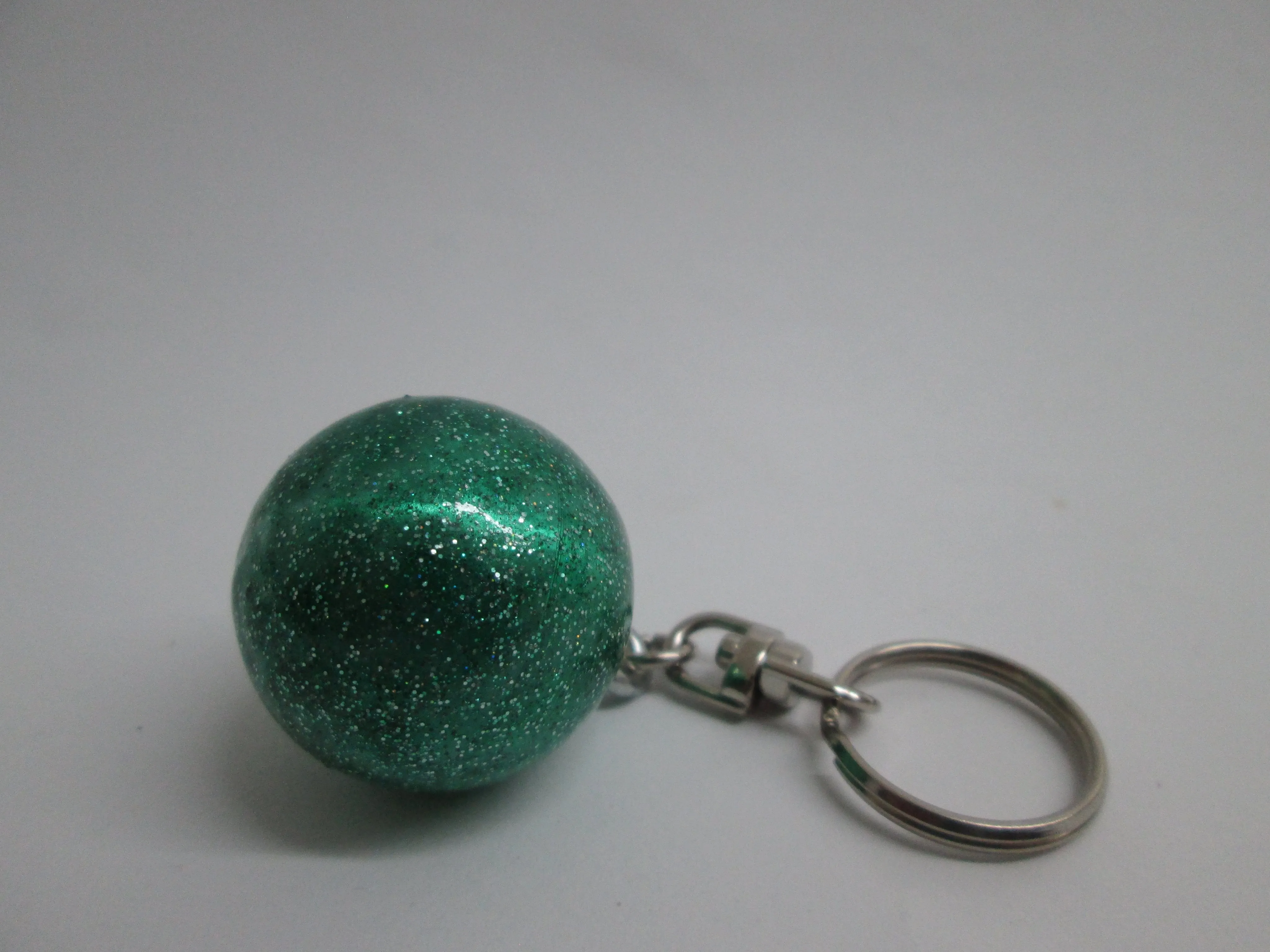 Llaveros de pelotas metálicas con glitter Pastorelli