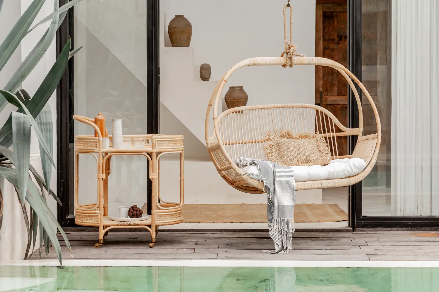The Glendora Rattan Bar Cart with wheels (West Coast delivery only)